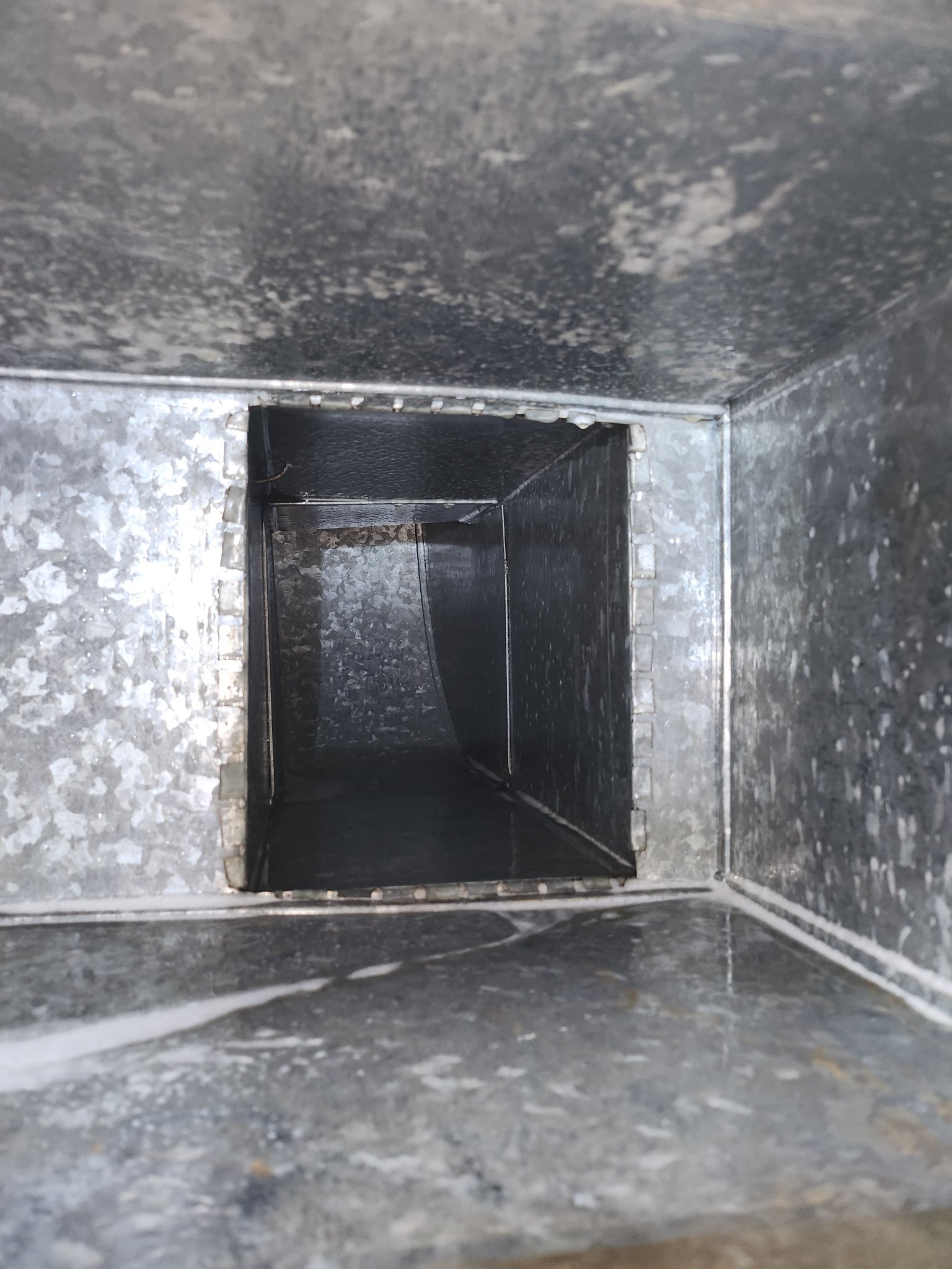 Inside a freshly cleaned air duct