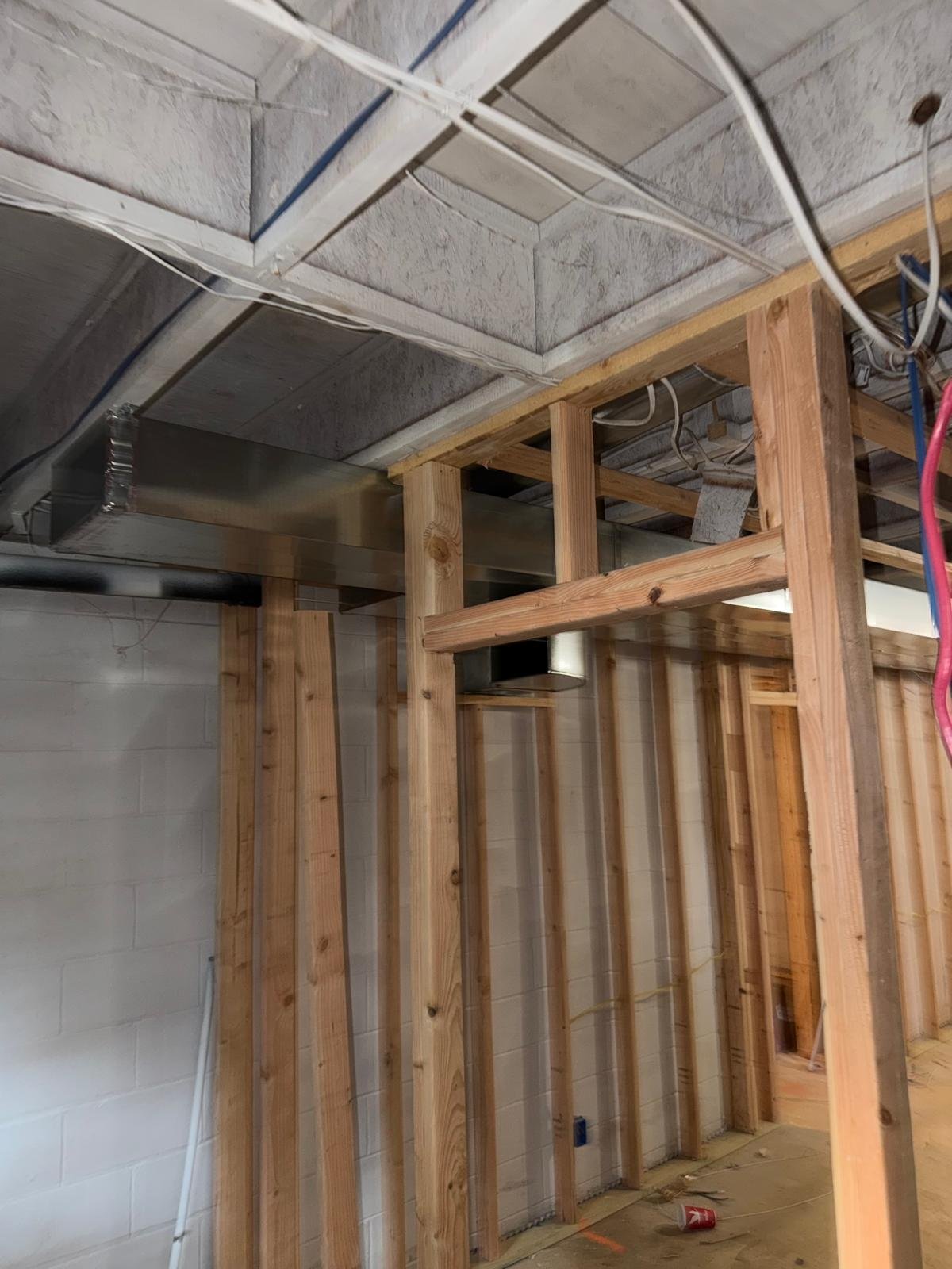 New duct run through wall framing, new construction